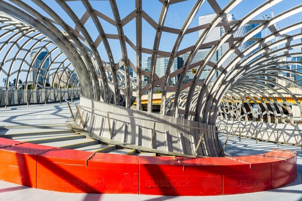 Inside view of 180 degree curve in an enclosed webbed steel pedestrian bride - Australian Stock Image