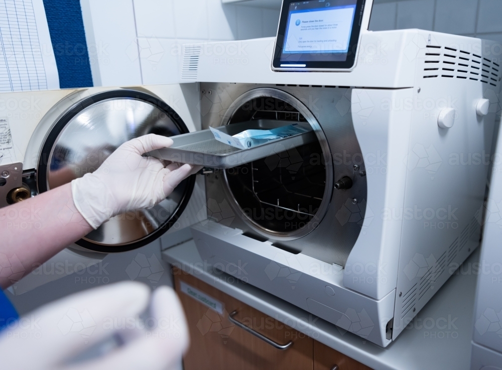 Instruments being sterilised in an autoclave - Australian Stock Image