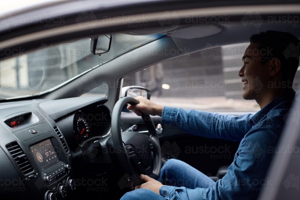 Interior of man driving car - Australian Stock Image