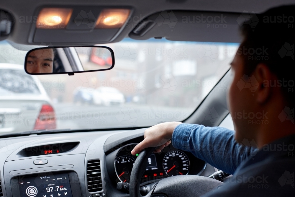 Interior of man driving car - Australian Stock Image