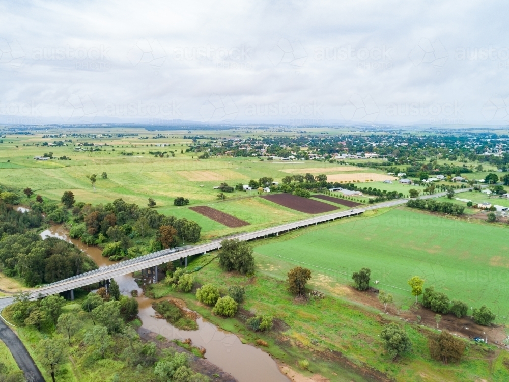 Intersection of country roads going to bridge towards town of Singleton - Australian Stock Image