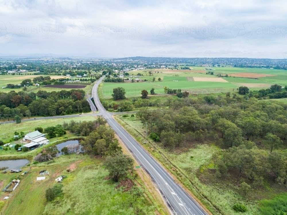 Intersection of country roads going to bridge towards town of Singleton - Australian Stock Image