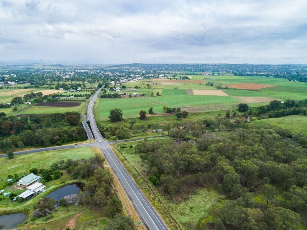 Intersection of country roads going to bridge towards town of Singleton - Australian Stock Image