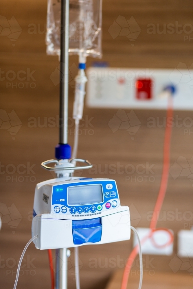 IV medical drip machine in hospital room - Australian Stock Image