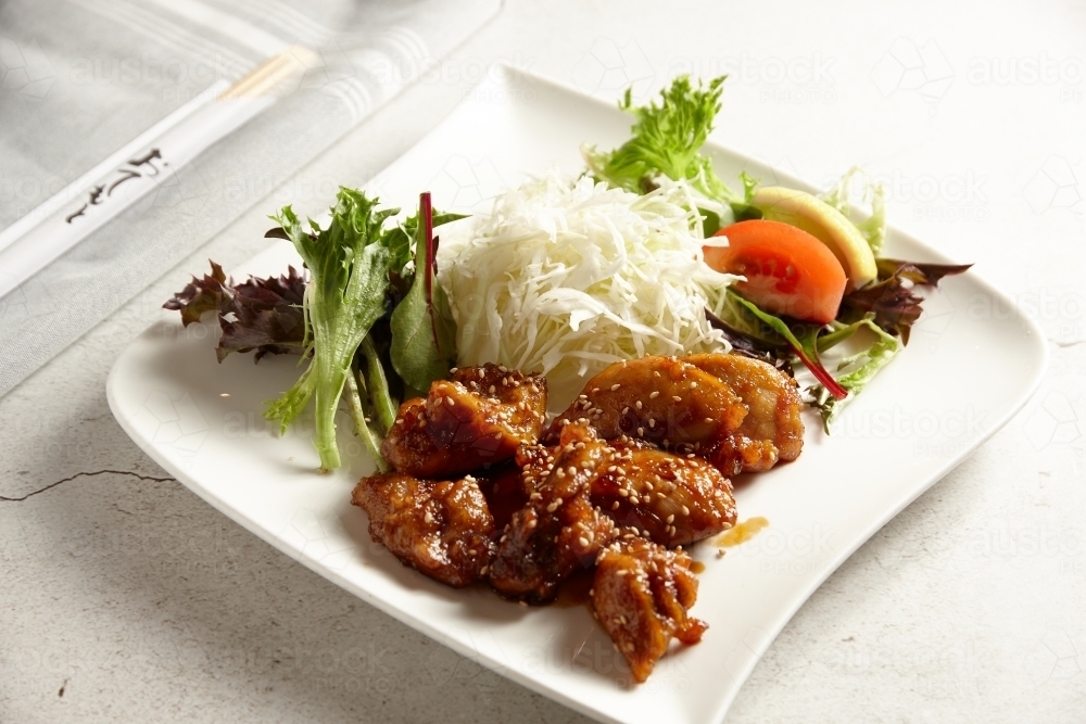 Japanese chicken and salad dish - Australian Stock Image