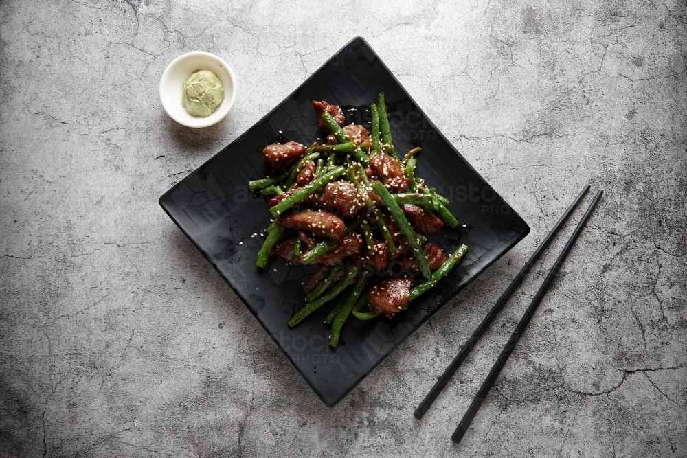 Japanese style beef fillet on black plate - Australian Stock Image