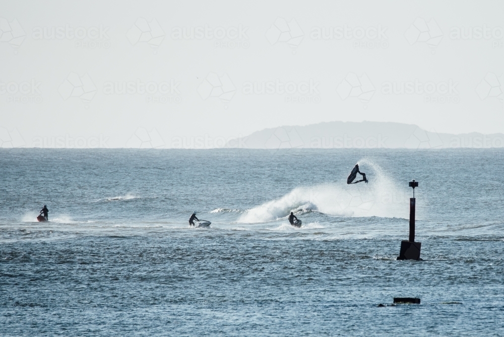 Jet skiing on the ocean - Australian Stock Image