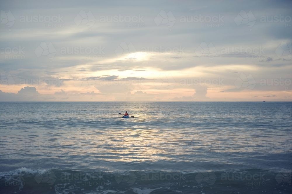 Kayaker alone at sunset - Australian Stock Image