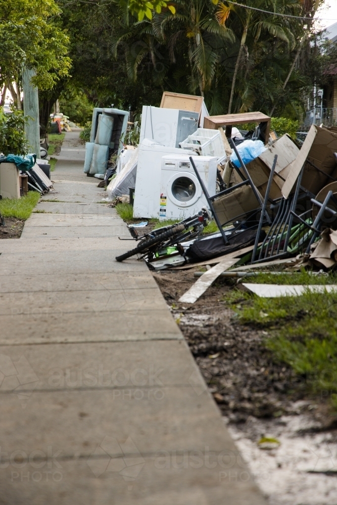 Kerbside waste and rubbish put out for collection after major flooding - Australian Stock Image