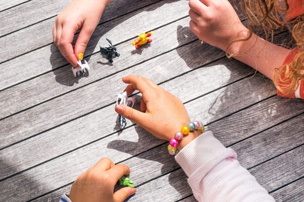 Kids little hands play with toys - Australian Stock Image