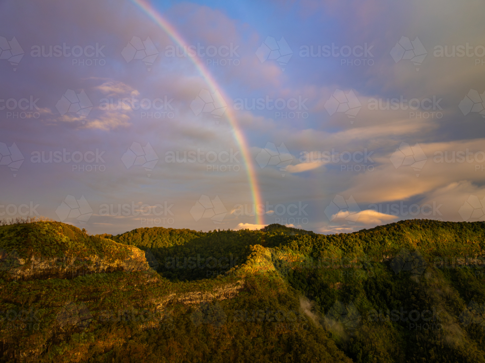 Landscape of mountains with rainbow - Australian Stock Image