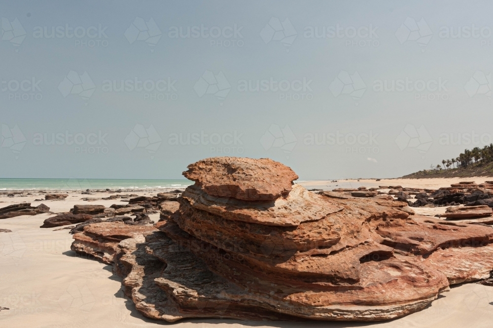 landscape of red rocks on Cable Beach Broome - Australian Stock Image