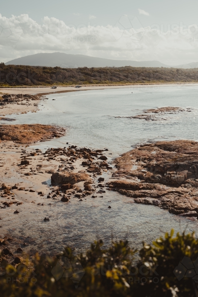 Landscape of the rocky coast and clear water at Diamond Head Beach, NSW. - Australian Stock Image