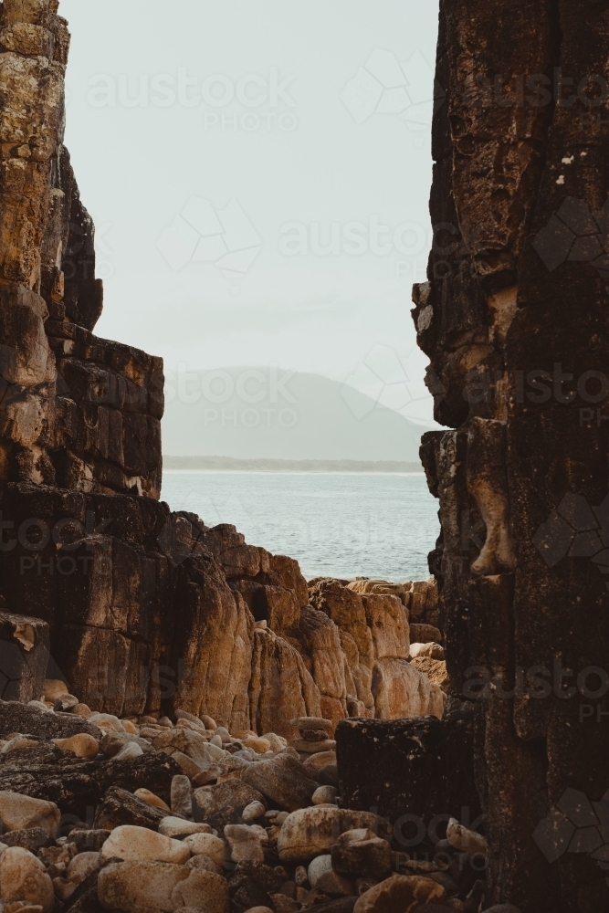 Landscape of the rocky coast and clear water at Diamond Head Beach, NSW. - Australian Stock Image