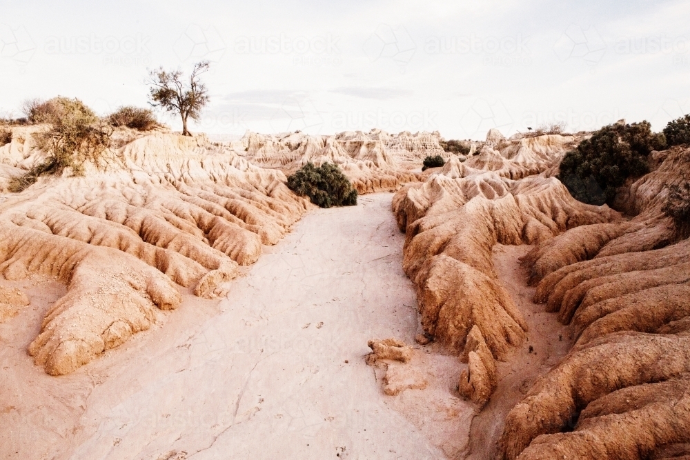 Landscape shot of land with rock wavy formation in rural place - Australian Stock Image