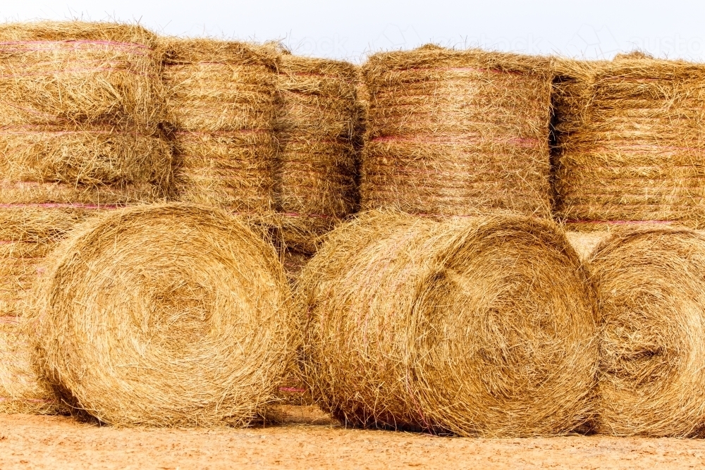 Large hay bales delivered and stacked for drought relief. - Australian Stock Image