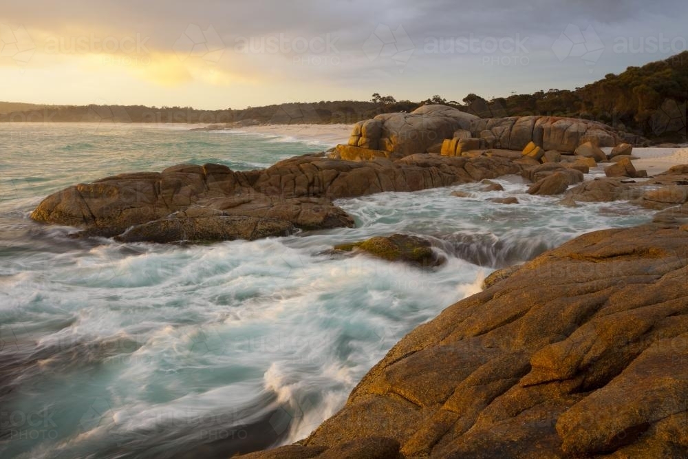 Large rocks with surf breaking - Australian Stock Image