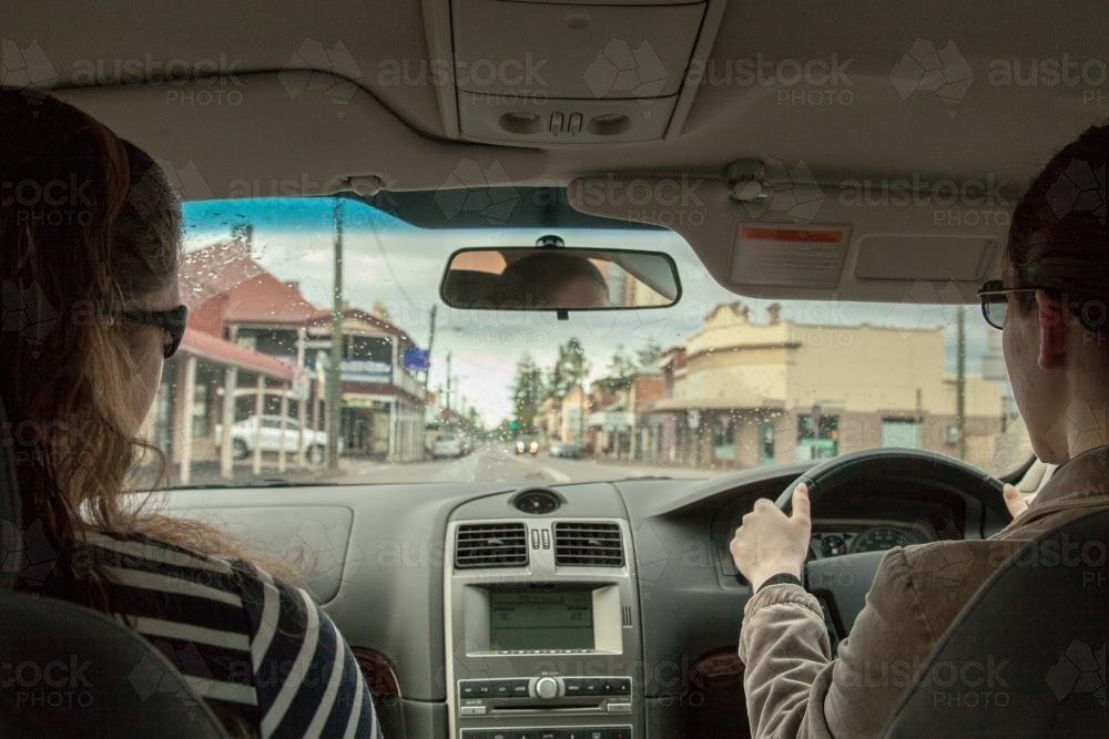 Learner driver getting rain driving experience - Australian Stock Image