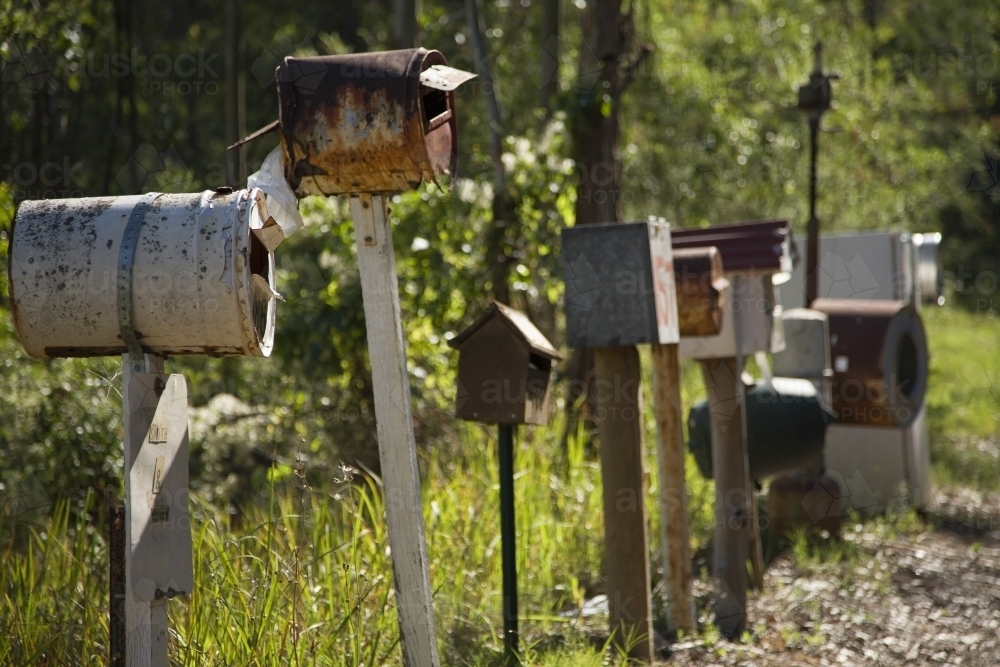 Letterboxes in a row on a country road - Australian Stock Image