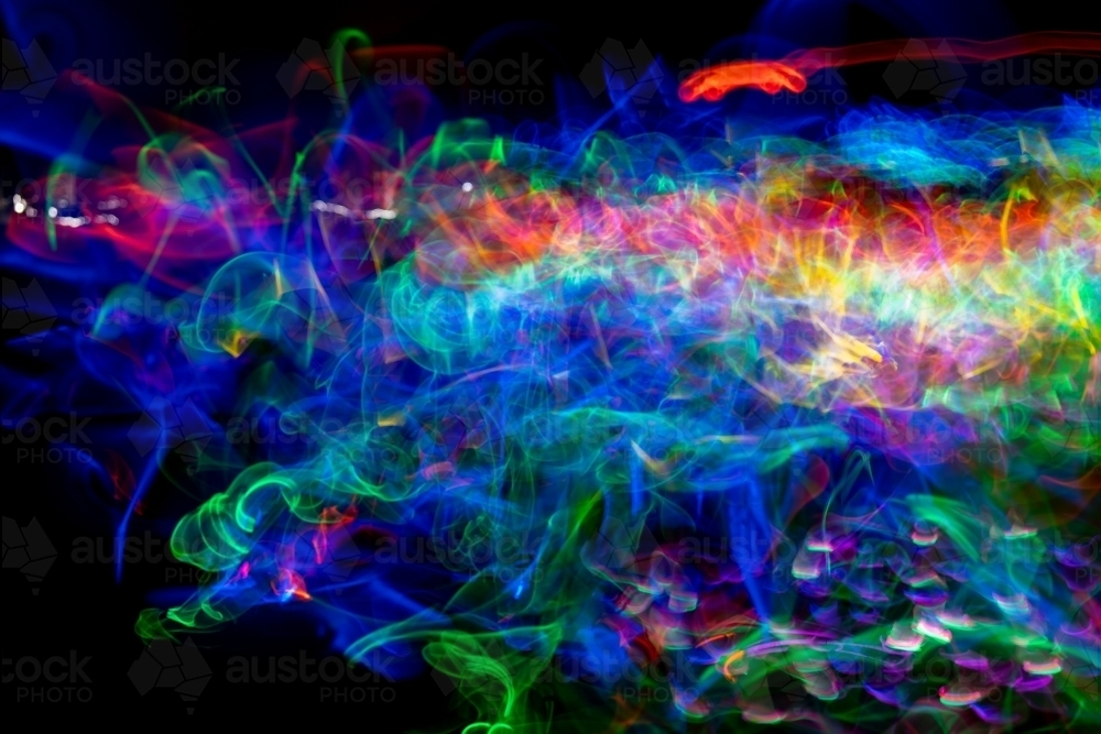 Image of Light motion blur with glow sticks - Austockphoto