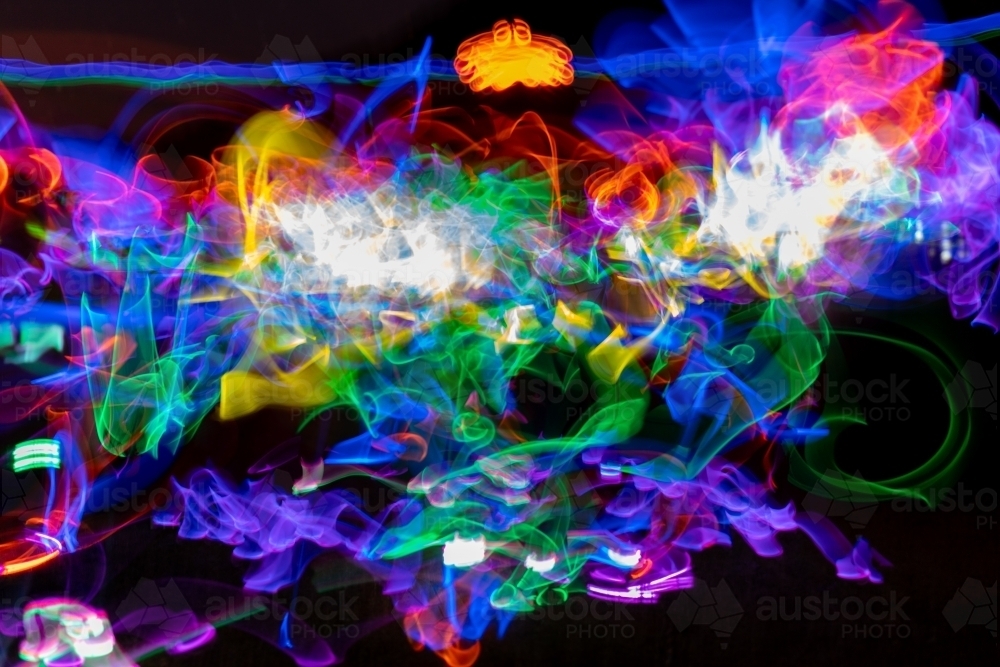 Light painting with multiple glow sticks - Australian Stock Image