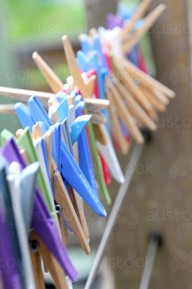 Line of pegs on wire - Australian Stock Image