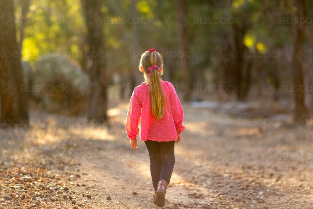 little girl walking away