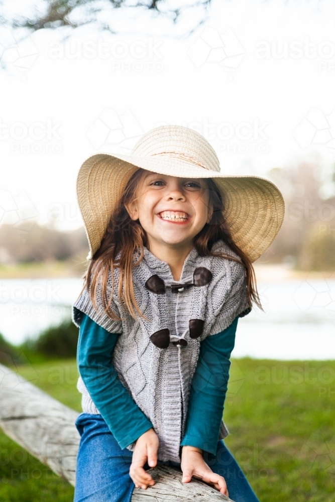 little girl with a big hat and bigger grin - Australian Stock Image