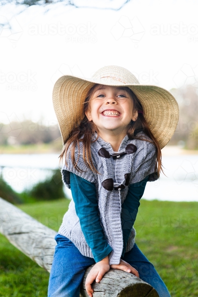 little girl with a big hat and bigger grin - Australian Stock Image