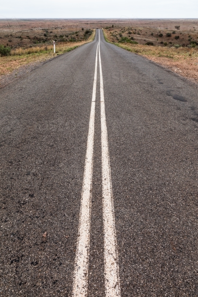 Long straight road with double unbroken lines - Australian Stock Image