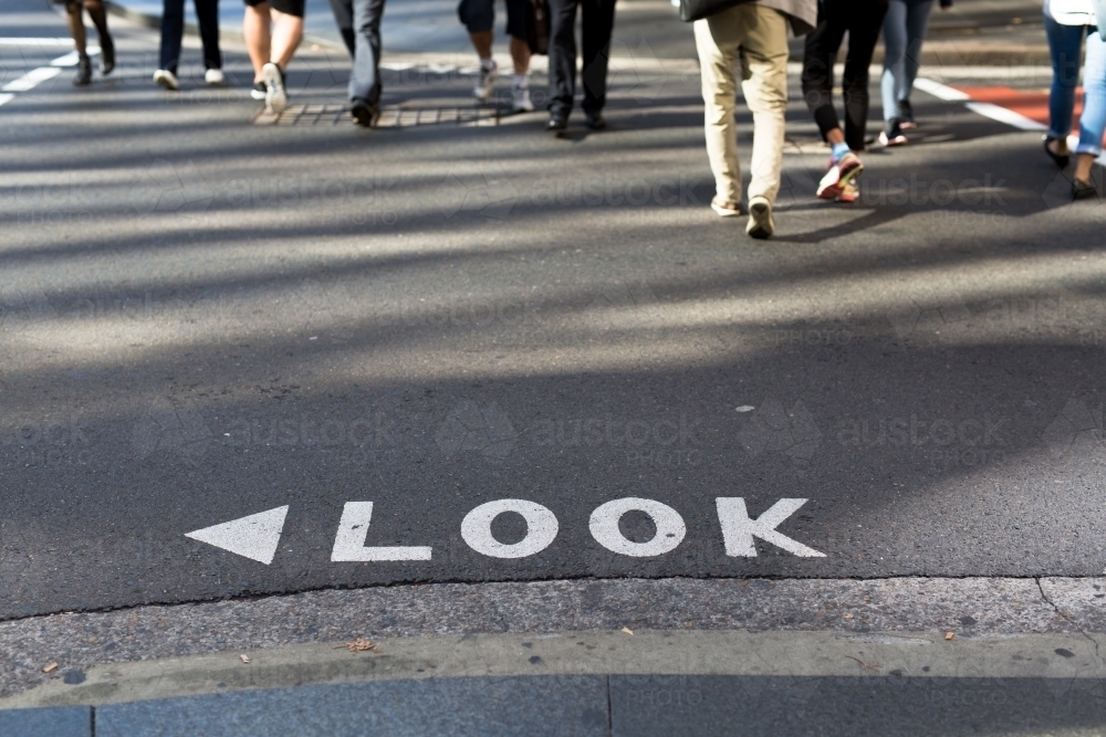 Look sign on a road at a busy intersection in the Sydney CBD - Australian Stock Image