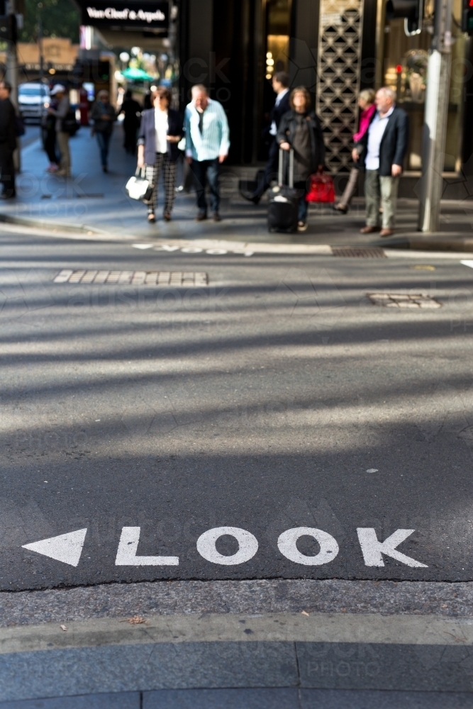 Look sign on a road at a busy intersection in the Sydney CBD - Australian Stock Image