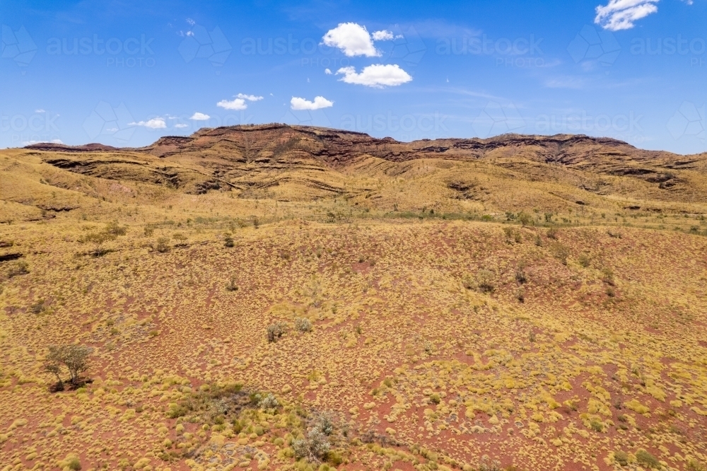 Looking at red mountainous terrain earth in outback Australia - Australian Stock Image