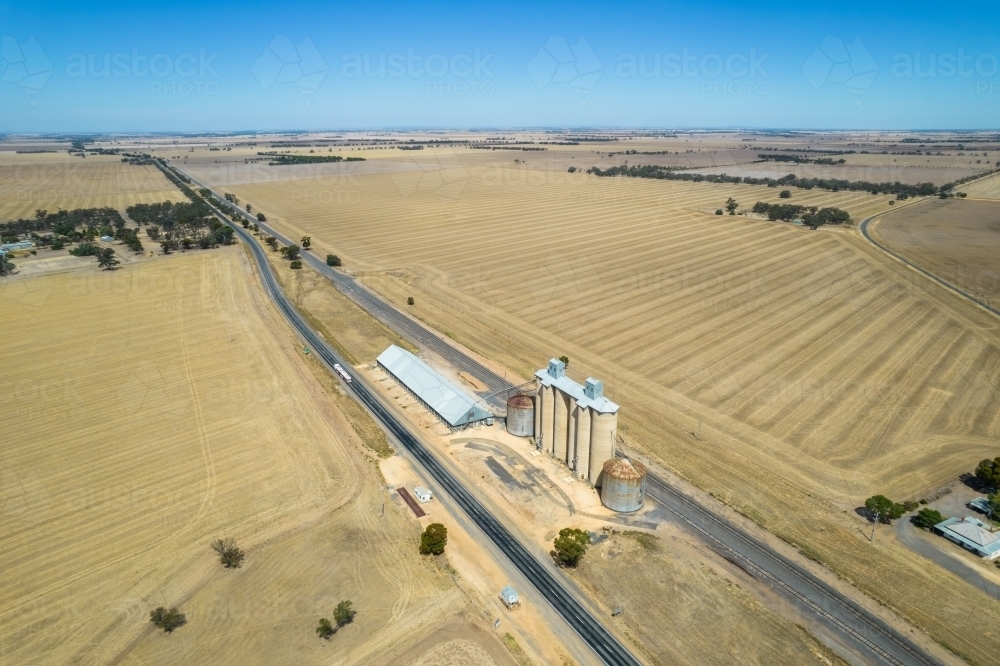 Looking down at silos, grain storage and railway line in the Mallee - Australian Stock Image