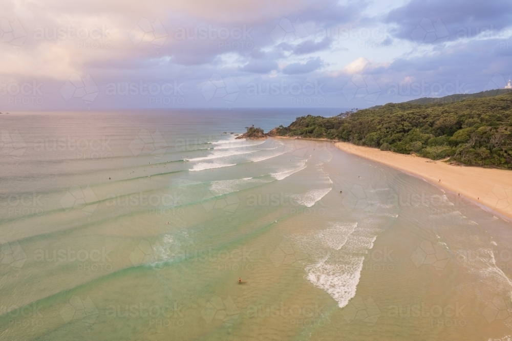 Looking down at the layers of waves heading into shore at the end of the day along the coast - Australian Stock Image