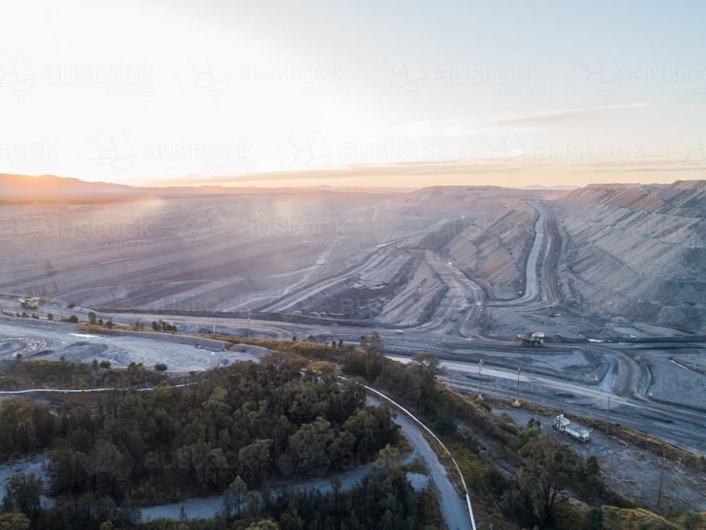 looking down into an open cut coal mine in Bulga area of the Hunter Valley at dusk - Australian Stock Image