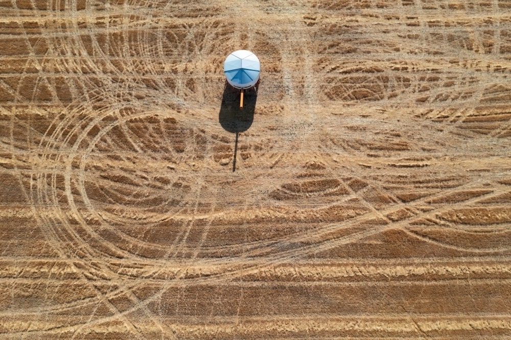 Looking down on a field bins in a paddock surrounded by looping wheel tracks - Australian Stock Image