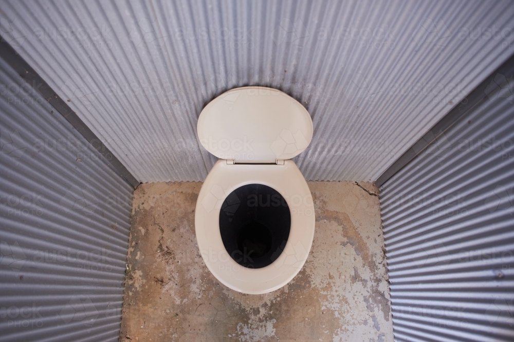 Looking down on a long drop public toilet in a remote picnic area. - Australian Stock Image