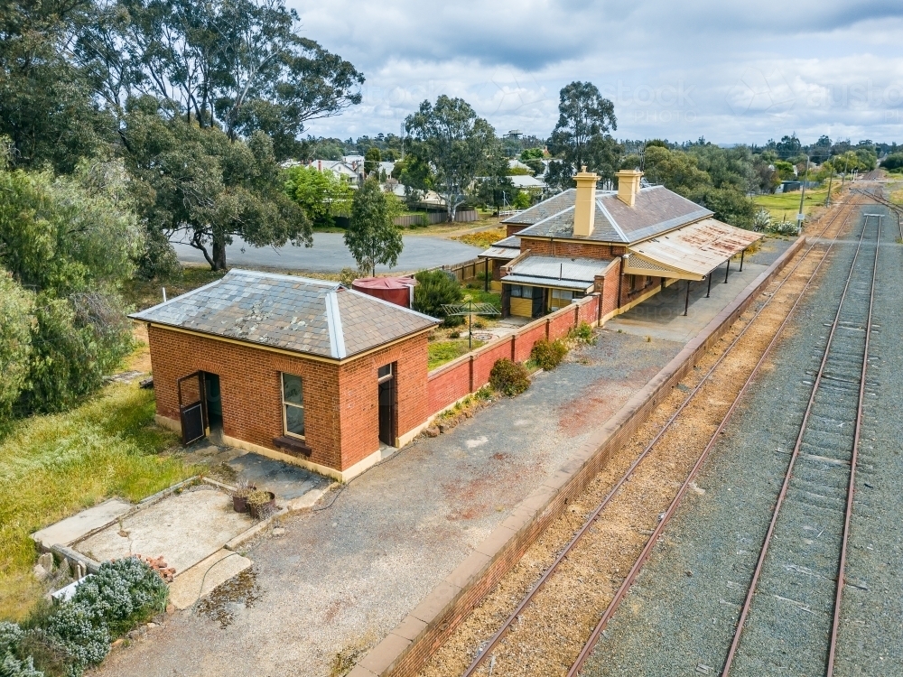 Looking down on railway station and platform in a rural town - Australian Stock Image