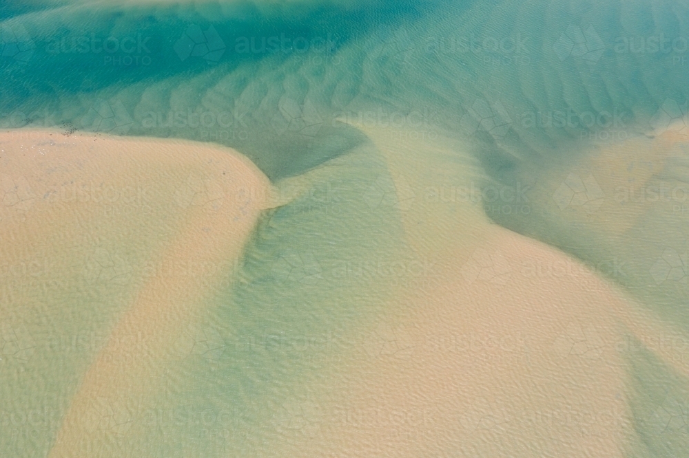 Looking down on sand bars and tidal patterns in a coastal river - Australian Stock Image