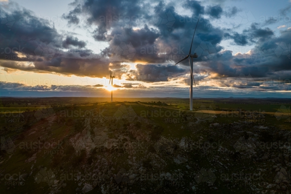 Looking down on wind turbines at sunrise. - Australian Stock Image