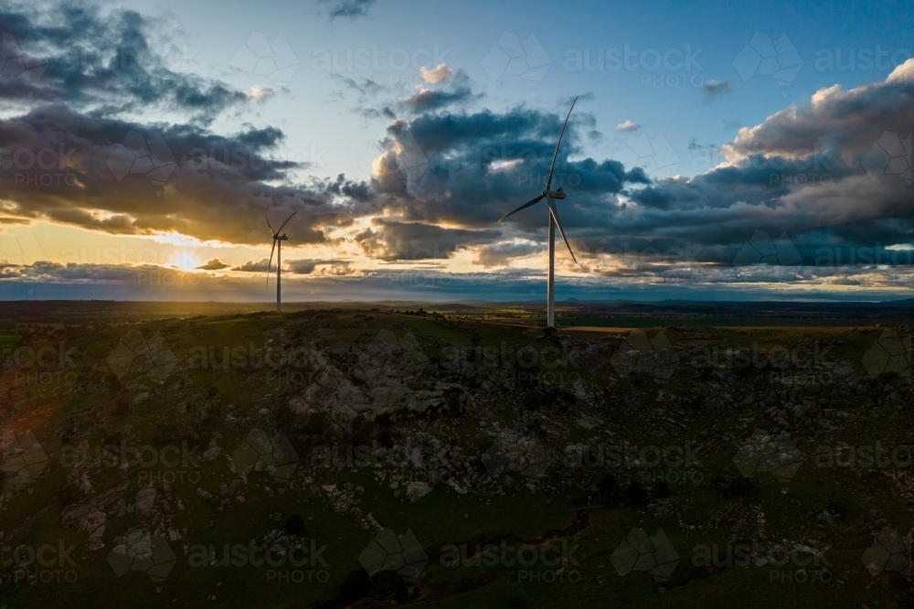 Looking down on wind turbines at sunrise. - Australian Stock Image