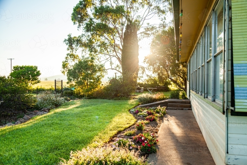 Looking down the side of a farm house and garden - Australian Stock Image