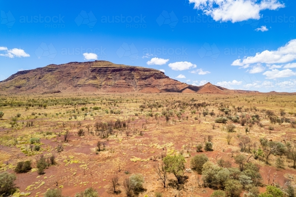 Looking out at the dry arid land with mountains close by in the outback - Australian Stock Image