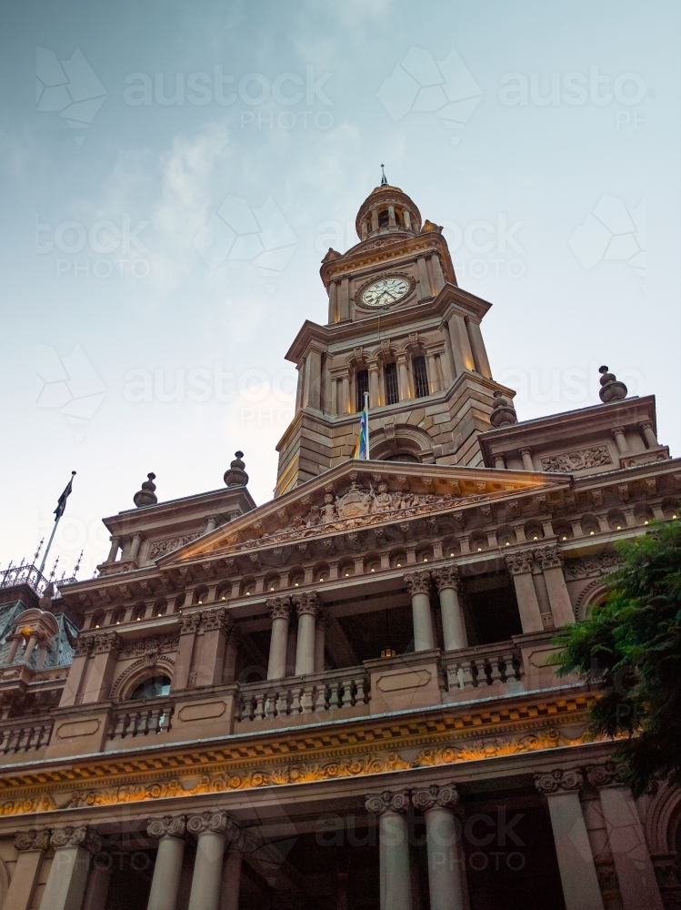 Low-angle shot of Sydney Town Hall with pride flag - Australian Stock Image