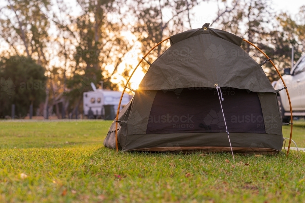 Image of Low angle view on a sleeping swag set up on a grassy area of a ...