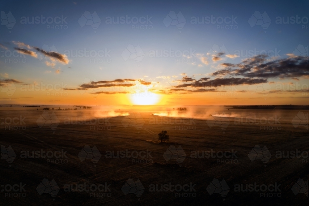 Low sunset over agricultural fields - Australian Stock Image