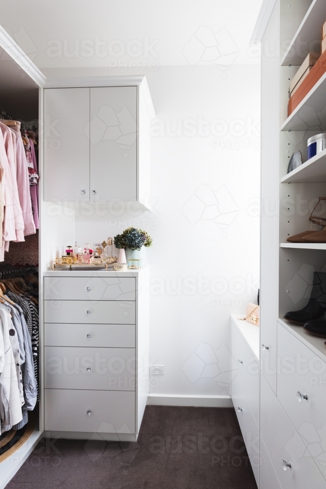 Luxury walk in wardrobe in a renovated home - Australian Stock Image