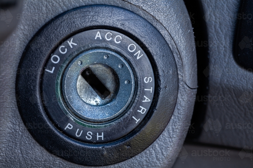 Macro shot of worn key ignition keyhole to start car - Australian Stock Image