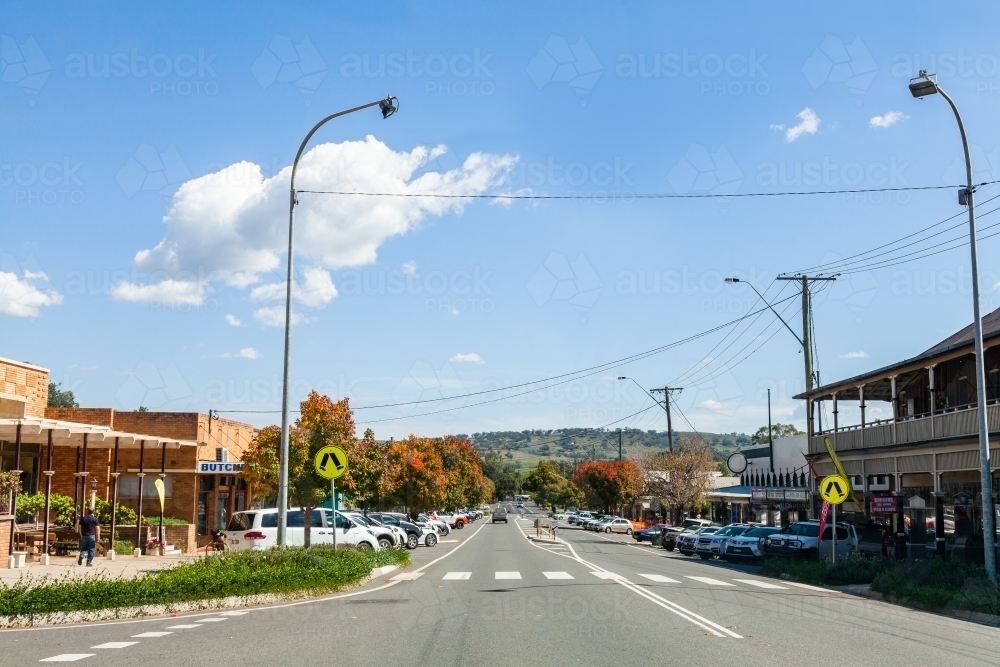 Main street in NSW country town of Merriwa on bright sunlit Autumn day - Australian Stock Image